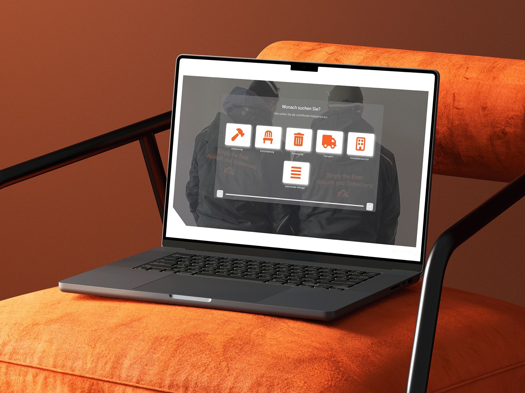 Simply the Best website on a MacBook on an orange armchair